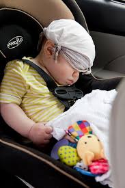 infant sleeping in a car